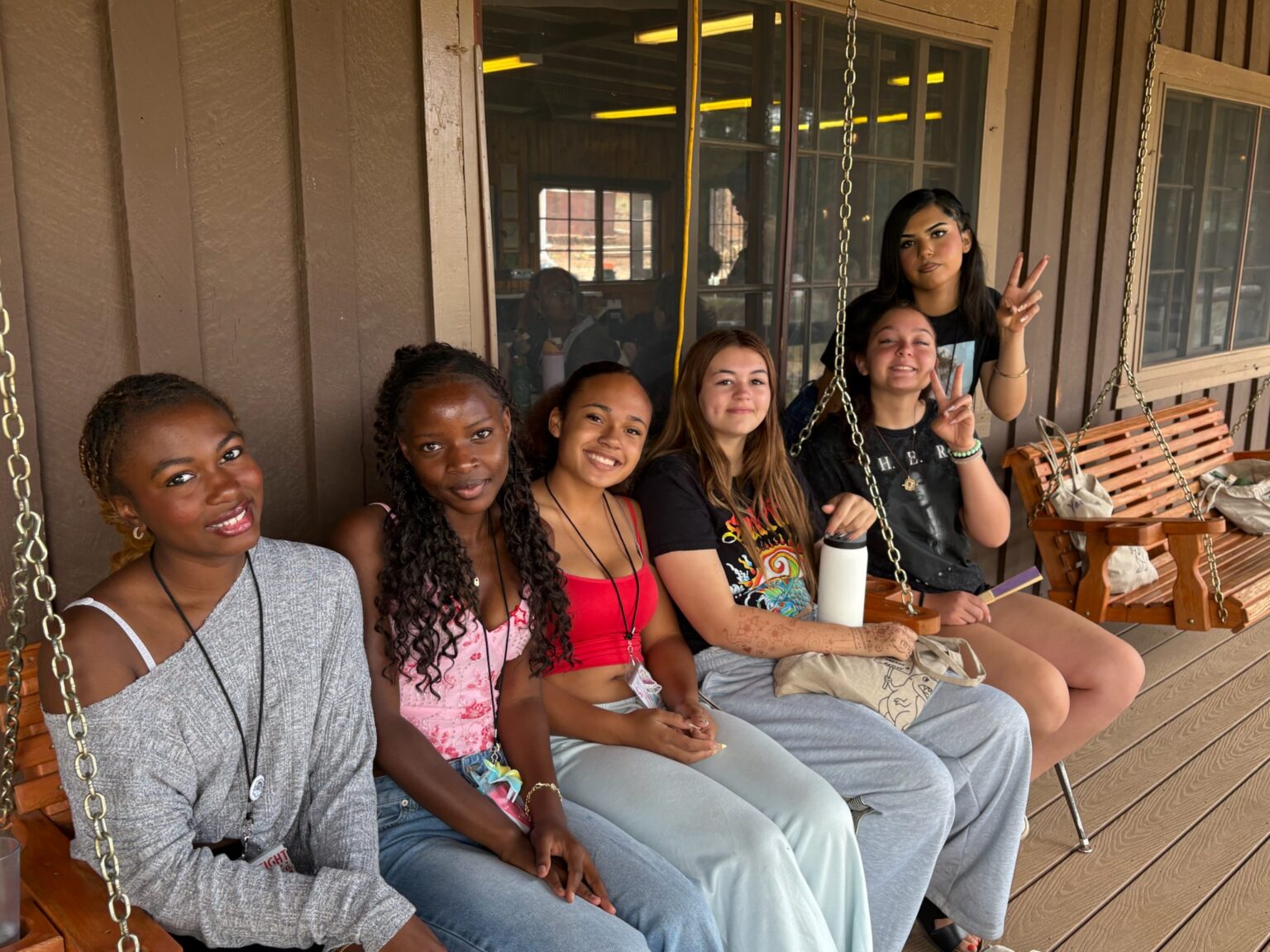 Delegates relaxing together on a porch swing